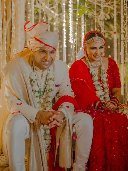 A sweet moment between the bride and groom. Her radiant makeup complements his classic attire perfectly.