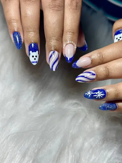 Another angle of these fun winter-themed Christmas nails. The combination of different patterns and textures makes this set so unique.