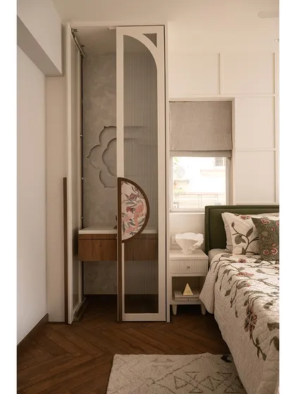 A full view of the guest bedroom with the mandir doors open. The design ensures that the sacred space feels like an integral part of the room, creating a harmonious environment for both rest and reflection.
