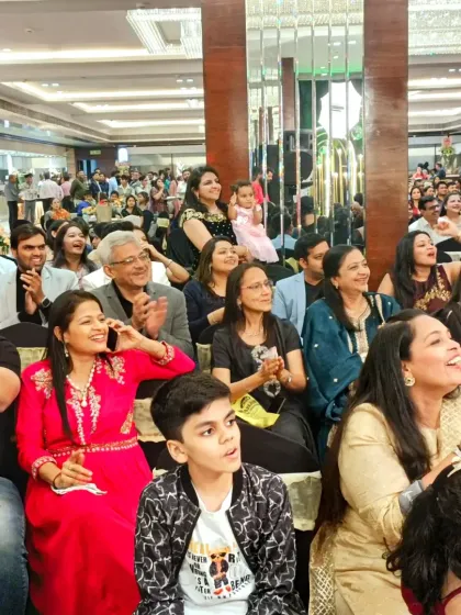 A happy and engaged audience at a Sangeet ceremony. Seeing the guests enjoy the performances and the show I've curated is incredibly rewarding.