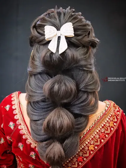 A back view of the stunning bubble braid, showing the volume and texture that make this style so eye-catching.