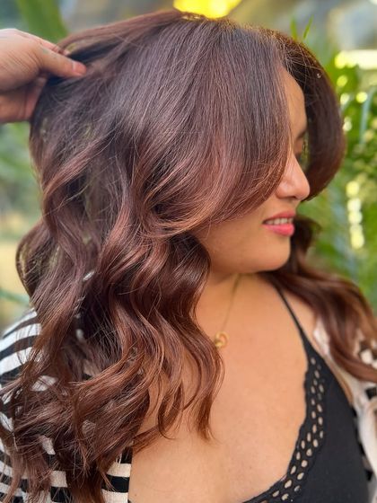 A beautiful, warm copper-brown hair color that makes my client look and feel amazing. The color is rich, vibrant, and full of life.