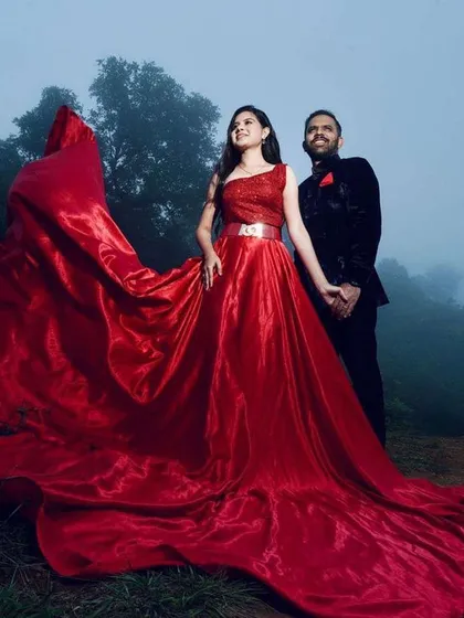 For dramatic pre-wedding photoshoots like this one in the misty hills of Chikmagalur, the makeup needs to be both beautiful and resilient. I designed a look that enhanced her features and paired beautifully with this magnificent red gown, ensuring she looked flawless throughout the outdoor shoot.