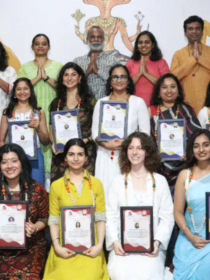 A large group of happy graduates from our 300-hour Yoga Teacher Training Course, a program designed for those ready to advance their teaching skills.