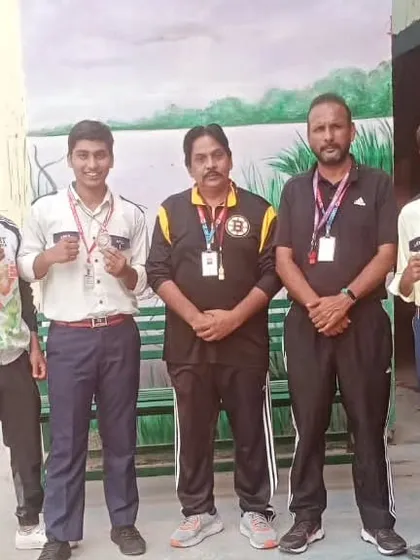 My boxers with their school coaches and their medals. It's a team effort between the academy and the school.