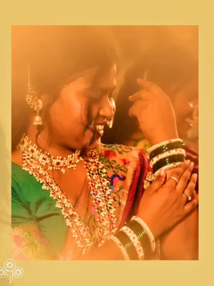 The green bangles and traditional jewellery create a perfect festive look.