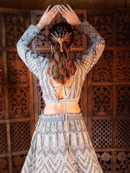 A complete look at my silver-grey geometric lehenga from a professional shoot. You can see the intricate details, the stylish back, and how it moves. It's a true work of art.