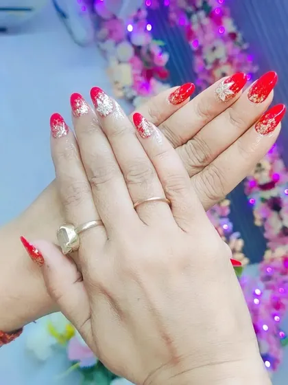 A classic festive combination of bright red nails with gold leaf accents on the tips. This look is elegant, timeless, and perfect for any celebration.