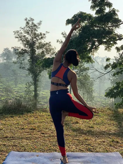 A variation of Tree Pose with a side bend, which is another great way to open the hips and challenge your balance. Hip openers improve posture and can release stored emotional stress.
