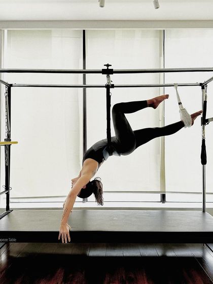 Another view of the hanging stretch, showcasing the length and release it creates in the body.