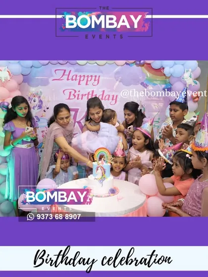 The best part of any party is the celebration! Here's the birthday girl and her friends enjoying the cake cutting in front of the unicorn-themed backdrop I created.
