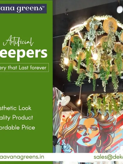 Greenery that lasts forever. These artificial creepers have been used to create a stunning chandelier-like installation in a cafe, blending art with nature.