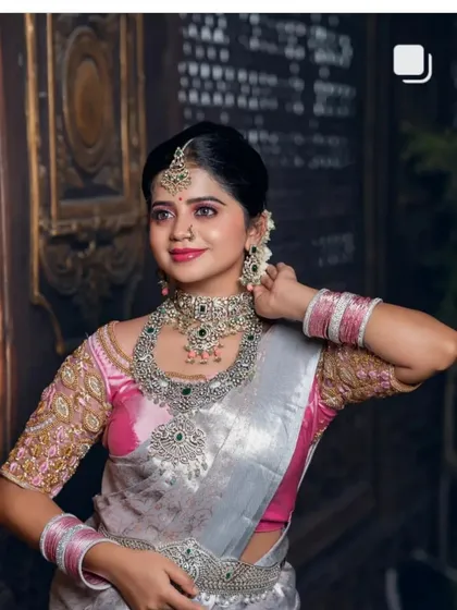 A screenshot of the silver saree look, showing the complete ensemble.