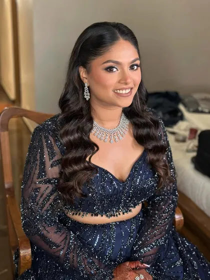 This bride wanted a sangeet look that would stand out. I created this fierce blue shimmer wing and paired it with flawless, glowing skin and a matte nude lip for a perfect balance of bold and beautiful.