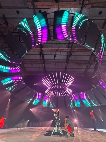 A wide shot of the massive circular LED and lighting rig we constructed for a Sunsilk commercial. The combination of the video wall and programmed moving lights created a spectacular, high-tech environment.