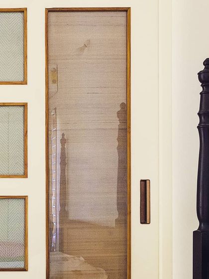 Detail is everything. Here, I've used panels of woven silk fabric within a door frame, celebrating Indian textiles and adding a layer of texture and craftsmanship to the interior.