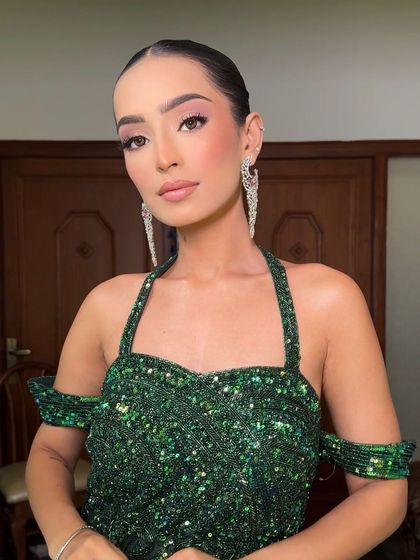 The model looking chic and powerful with her sleek updo, a testament to how a great hairstyle can elevate an entire look.