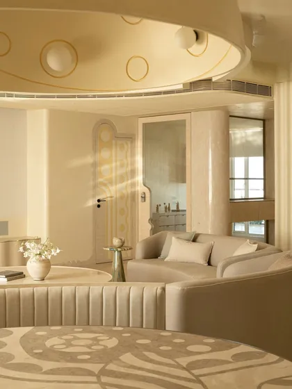 We see dining tables as centerpieces for stories and meals. This piece features a custom marble inlay top with sinuous patterns inspired by illustrator Jane Foster, crafted from Crema Marfil and Federal Beige marble. It’s paired with a fluted banquette, creating an intimate and artistic dining nook.