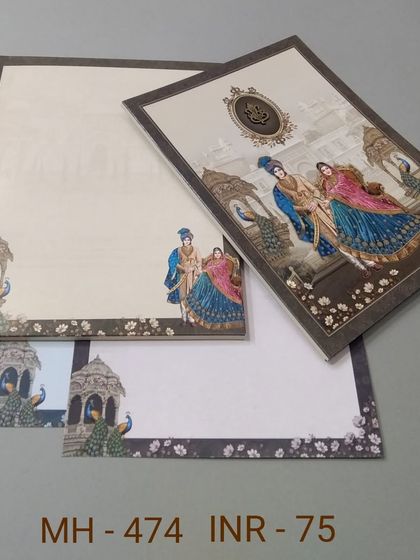 This card features a royal couple surrounded by peacocks against a palace backdrop. The design is rich in color and traditional motifs, perfect for a vibrant wedding.