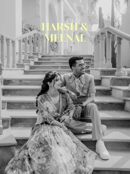 A black and white portrait of the couple, set against the grand staircase of their wedding venue. The yellow text overlay adds a modern, artistic touch to this classic shot.