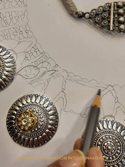Every heirloom begins as a whisper on paper. Here, you can see my hand-drawn sketch next to the finished components, showing how I translate imagination into tangible ornaments. This is the first step in our bespoke journey together.