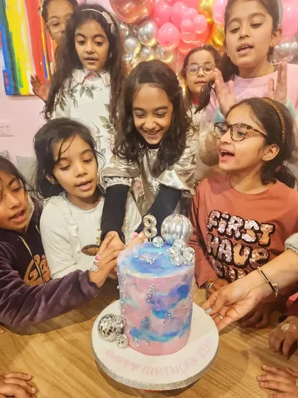 This is why I do what I do! The smiles on these kids' faces as they gather for the cake cutting says it all.