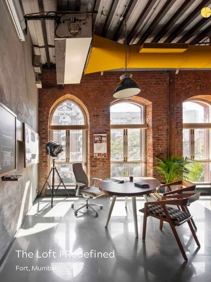 The 'Thinker's Corner' in our own studio, The Loft. This space, with its exposed brick and arched windows, serves as our primary area for brainstorming and collaboration, embodying our belief in creating environments that spark creativity.