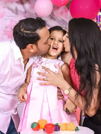 A moment of pure joy and love. We live for these unscripted kisses and happy squeals that make birthday memories so precious.