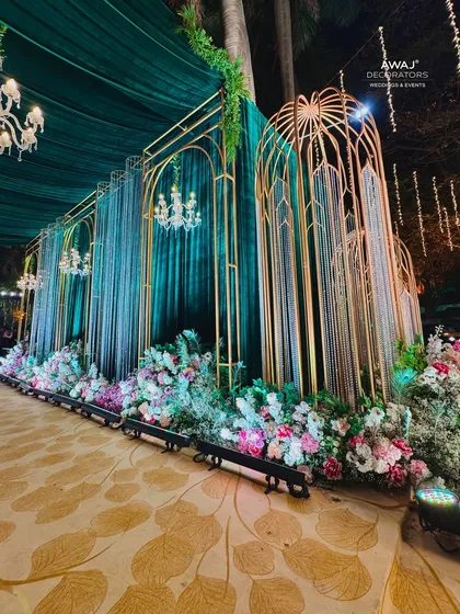 The walkway decor from another angle, showing the lushness of the floral beds and the elegance of the design.