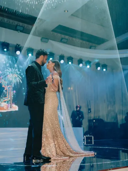 The couple's first dance, under a single spotlight. It's a classic, romantic moment that we love to create, ensuring the focus is entirely on their love.