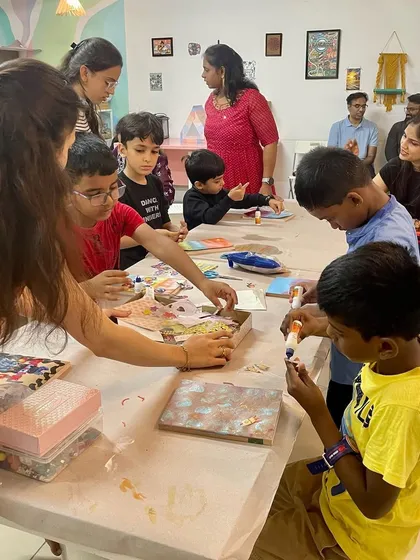 Another view of a mixed media art party, with kids and parents all getting creative together.
