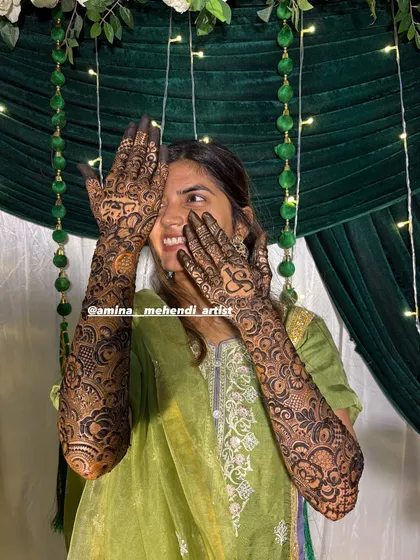 Another joyful shot of the bride with her personalized mehendi.