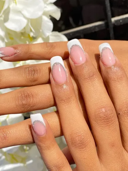 You can't go wrong with a classic French manicure, but I had to add a little sparkle. This set features a clean white tip on a squared nail shape, outlined with a delicate silver glitter line for that extra touch of glam. It’s an elegant and reusable set for any event.
