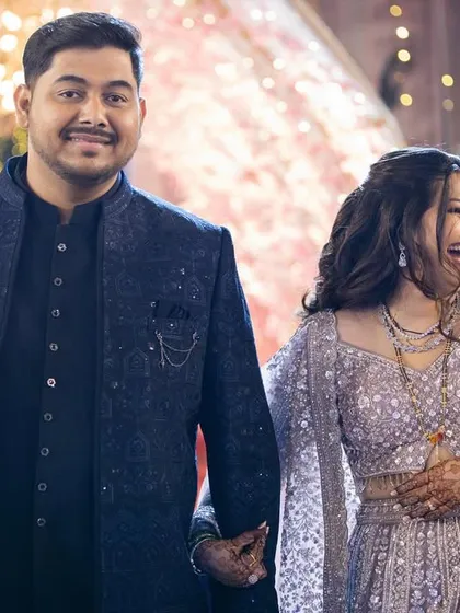 A candid moment of laughter from the reception. The makeup is designed to look great both in posed photos and in real-life moments.