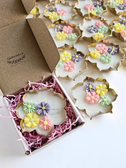 My Urli candles are a modern take on a traditional design. This one, with delicate pastel mini daisies, is nestled in our new gift box, ready to be a beautiful housewarming or festive favor. Each one is hand-poured with scented soy wax.