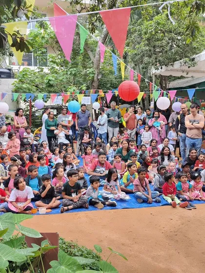 No crowd is too big. Here I am entertaining a large audience at an outdoor community event in Bangalore. My shows are designed to capture the attention of everyone, from the kids sitting up front to the parents in the back.