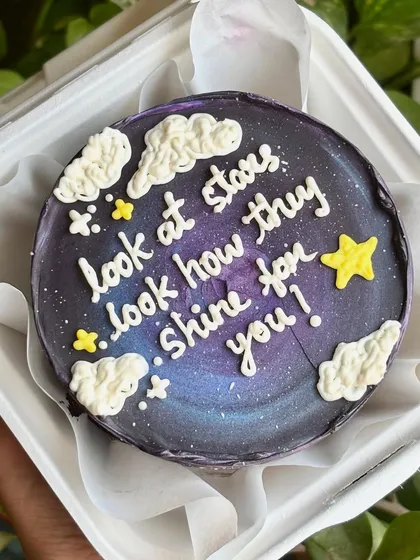 "Look at the stars, look how they shine for you." A cosmic bento cake with a galaxy frosting effect, perfect for a special someone who is your universe.