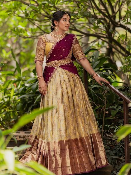 A beautiful shot in a lush green setting, highlighting the rich colors of the outfit.