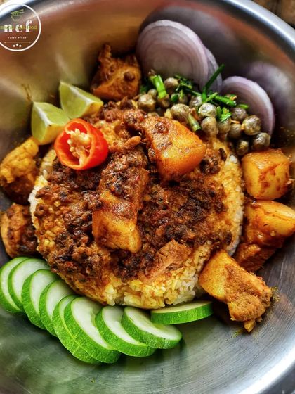 The rich aroma of pork cooked with fermented soybeans (hawaijar) and a side of fox nut chutney (thangjing).