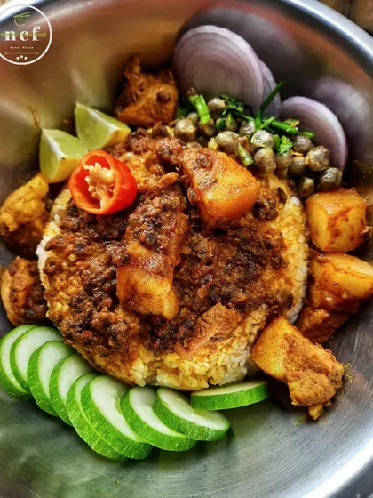The rich aroma of pork cooked with fermented soybeans (hawaijar) and a side of fox nut chutney (thangjing).