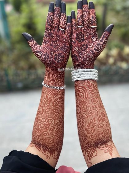 Another view of this stunning henna stain. The deep color from fingertips to elbows creates a complete and breathtaking bridal look.