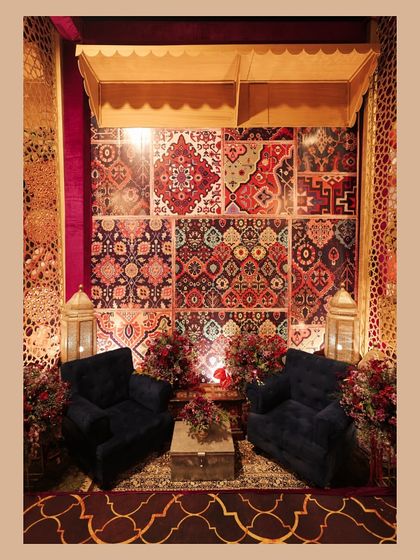 A design render next to the final result for one of the bazaar lounges. This shows how we translate a concept, like this cozy nook with a backdrop of layered rugs, from a digital drawing to a real-life space.