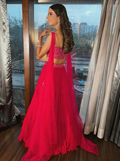 A view of the back of the engagement lehenga, showing the delicate straps and detailed embroidery on the blouse. Every angle is considered when I put together a look.