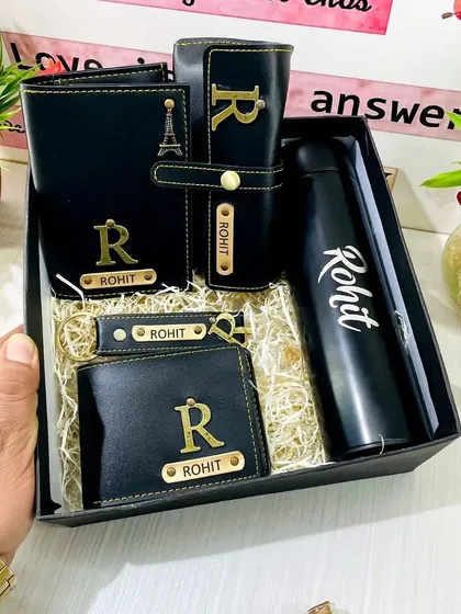 This is my premium, all-in-one men's gift hamper, perfect for birthdays or anniversaries. It includes a personalized temperature bottle, a vegan leather wallet, a matching passport cover, a sunglass holder, and a keychain, all customized with a name and initial.