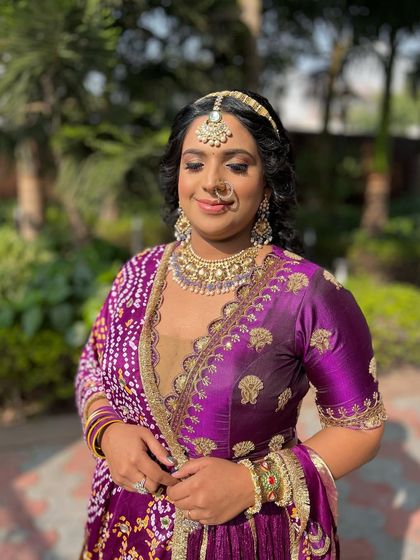 A happy client enjoying her party look. Her smile and the beautiful sunshine make this picture perfect.