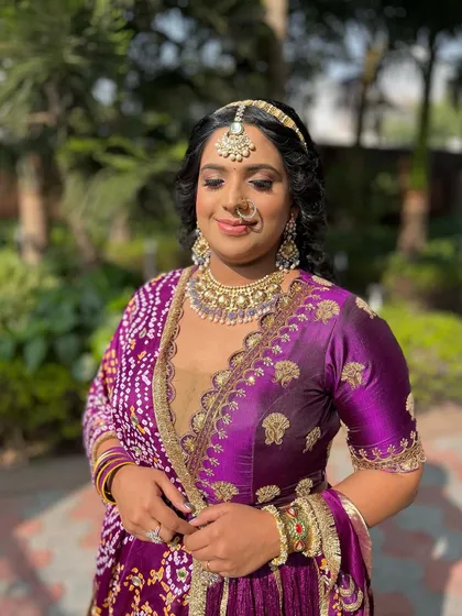 A happy client enjoying her party look. Her smile and the beautiful sunshine make this picture perfect.