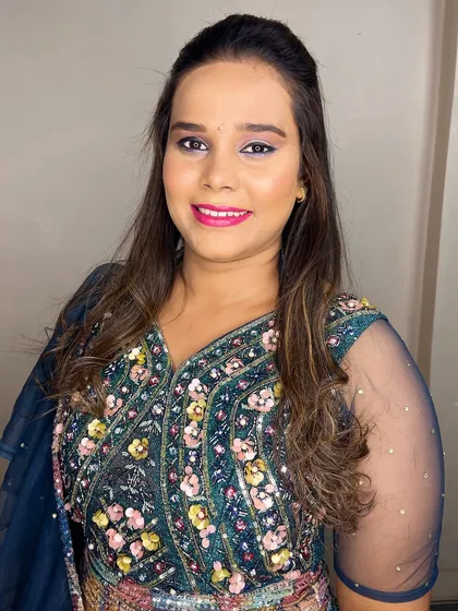 Nikita looking happy and ready to dance the night away. The makeup is set to last through all the festivities.