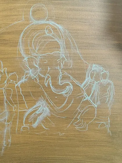 The initial chalk sketch of the Ganesha composition on the prepared canvas. Every detailed painting begins with a foundational drawing to ensure the structure and proportions are correct.