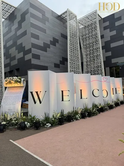 The full view of the personalized "WELCOME" walkway, a modern and heartfelt way to greet guests at a wedding reception.
