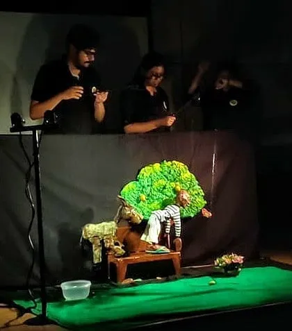 A view from the side of the stage, showing our team fully immersed in the performance.